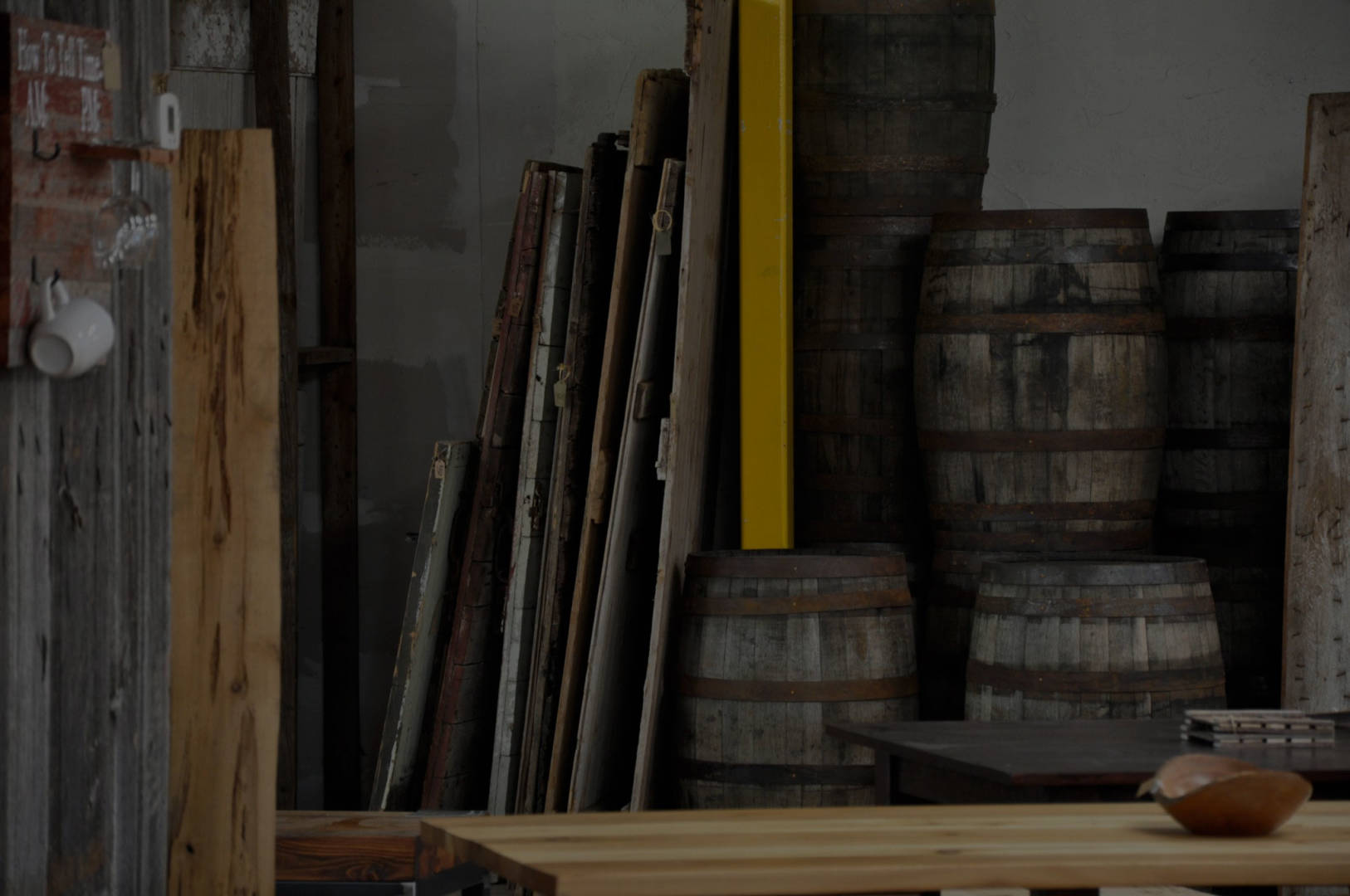 Backroom stocked with rustic barn wood for DIY reclaimed wood projects.