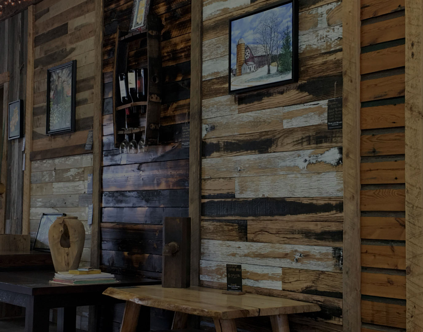 Our showroom, featuring a selection of reclaimed wood furniture and reclaimed wood beams.